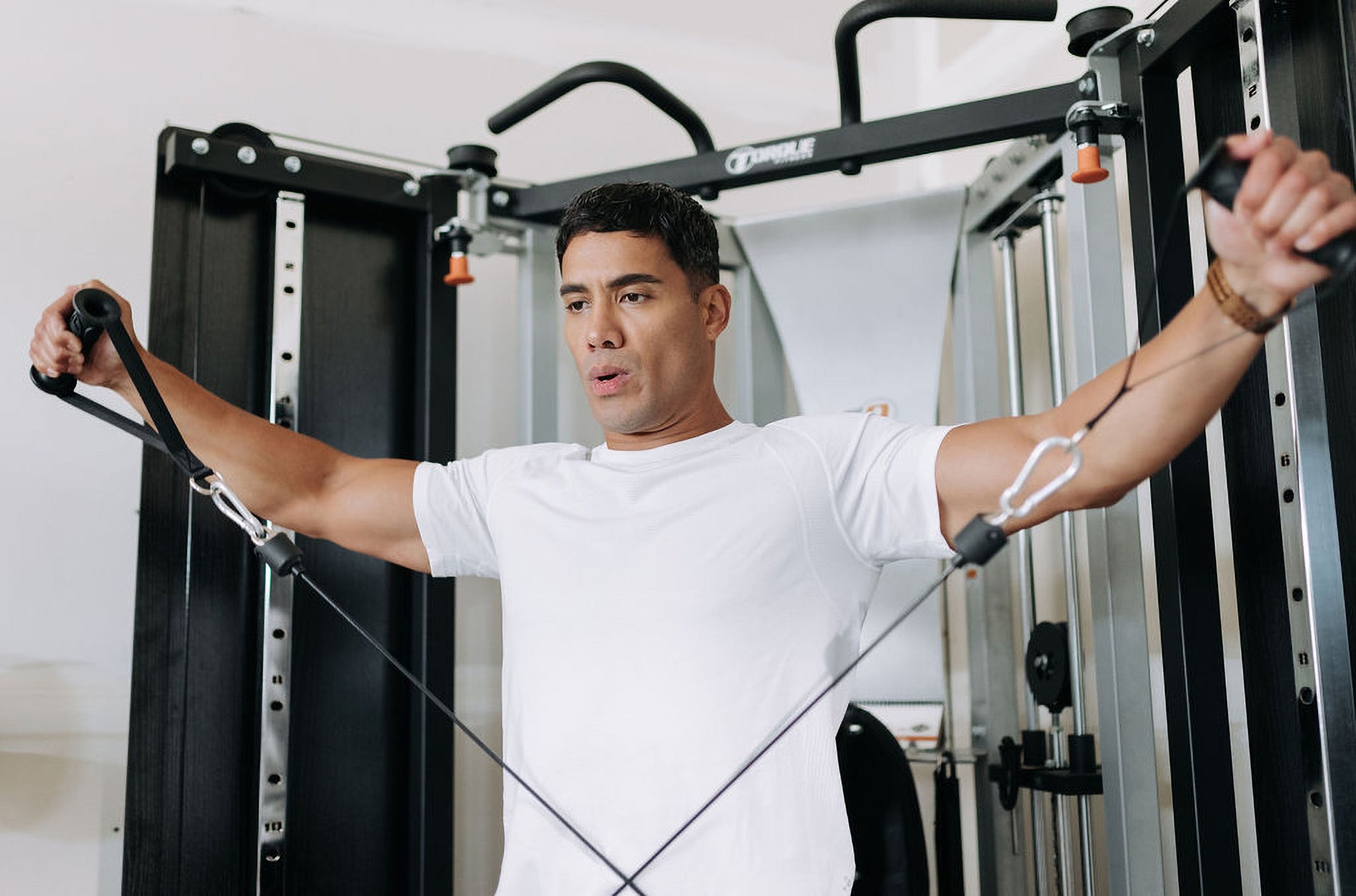 Man Using F9 Fold-Away Functional Trainer Accessories